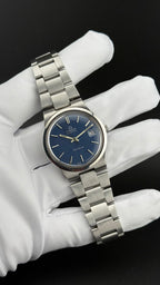 Omega Genève 166.0173 cadran bleu bracelet intégré